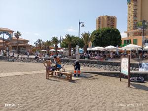 a group of people playing on the beach at Camper K Not for driving Playa las Vistas in Adeje