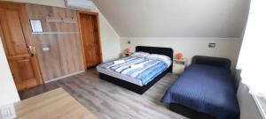 a bedroom with a bed and a sliding door at Holiday home in Keszthely - Balaton 54377 in Keszthely