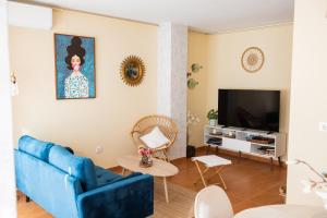 Μια τηλεόραση ή/και κέντρο ψυχαγωγίας στο Apartamentos Eras Centro