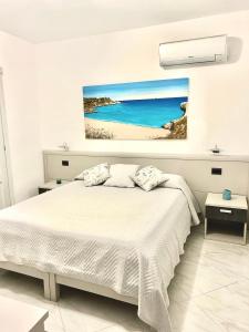 Postel nebo postele na pokoji v ubytování B&B I Colori Dell'Isola