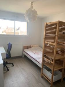 En eller flere senge i et værelse på Appartement 1er étage