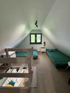 Posteľ alebo postele v izbe v ubytovaní Domek na górce