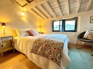 Ένα ή περισσότερα κρεβάτια σε δωμάτιο στο La Maison des Rêves
