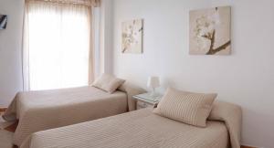Posteľ alebo postele v izbe v ubytovaní Hostal Jomarijo