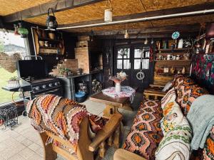 a living room with a couch and a stove at Haus Elena in Bestwig