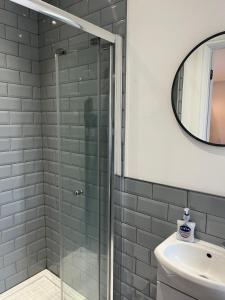 O baie la Fairfield Cottage Rooms +1 fotografie