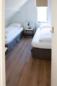 Postel nebo postele na pokoji v ubytování -Duna Lago- nabij het meer, restaurants en Keukenhof