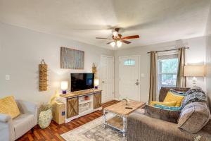 a living room with a couch and a tv at 3 Mi to Cherokee Reservoir Blue Haven Bungalow in Morristown
