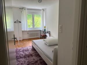 Postel nebo postele na pokoji v ubytování Au Zimmer + 6 fotografií