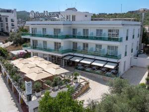 an aerial view of a hotel lobby with umbrellas at Hotel Luxury in Ksamil