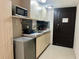 Eldhús eða eldhúskrókur á Apartaestudios - Torre de Cali