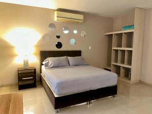 Rúm í herbergi á Apartaestudios - Torre de Cali