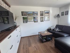 a living room with a couch and a table at TaWorld apartment in Šmartno pri Litiji
