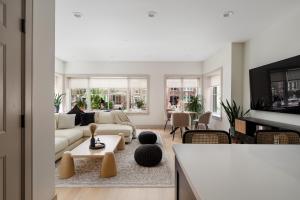 a living room with a couch and a table at Ace Properties in Chicago