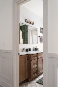 a bathroom with a sink and a mirror at Ace Properties in Chicago +88 photos