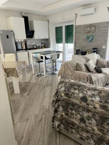 a living room with a couch and a table at Aria di Mare in Lido di Ostia