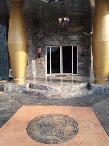 a building with a manhole in the middle of a floor at Diamond castle Hotel in Mama