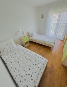 Postel nebo postele na pokoji v ubytování Apartment Garden