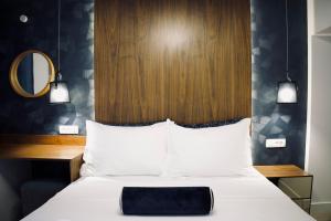 Hvar Riva Rooms客房内的一张或多张床位