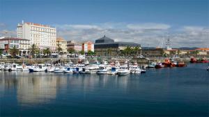 a bunch of boats are docked in a harbor at Apto Espectacular Plaza España in Ferrol