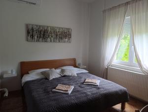 Ένα ή περισσότερα κρεβάτια σε δωμάτιο στο Apartments Rooster