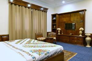 Μια τηλεόραση ή/και κέντρο ψυχαγωγίας στο Taha Inn Home comfort