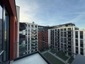 a balcony with a view of some buildings at BelgradeWATERFRONT - Apartments in Sajmište