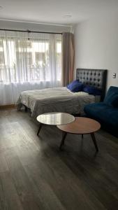 Ένα ή περισσότερα κρεβάτια σε δωμάτιο στο Elegante y calido +9 φωτογραφίες