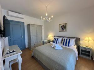 Postel nebo postele na pokoji v ubytování Bed & Breakfast Lupis