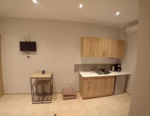 a kitchen with a sink and a counter top at Aelia Sea in Angón
