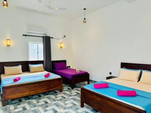 Postel nebo postele na pokoji v ubytování Sea Breeze Hotel