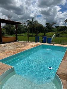 Bazén v ubytování Linda Fazenda Centenária em Três Corações nebo v jeho okolí