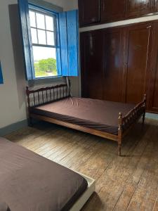 Postel nebo postele na pokoji v ubytování Linda Fazenda Centenária em Três Corações