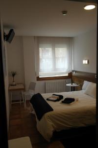 Posteľ alebo postele v izbe v ubytovaní Hotel Cuéntame