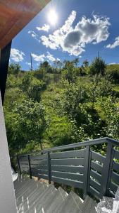 a view of a field from the balcony of a house at Vikendica Malekin in Ripci