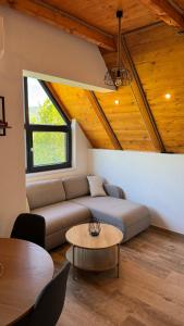 a living room with a couch and a table at Country House Malekin in Ripci +63 photos