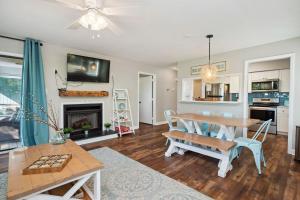 a living room with a table and a dining room at 19 Pinehurst in Oak Island