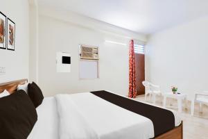 Postel nebo postele na pokoji v ubytování HOTEL O RAJ STAY