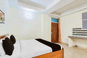Postel nebo postele na pokoji v ubytování HOTEL O RAJ STAY