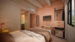 une chambre avec un lit et un bureau dans l'établissement Hotel Tres Altares Sabaneta, à Sabaneta