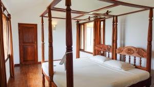 Postel nebo postele na pokoji v ubytování Pavillion Apartments