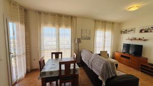 A television and/or entertainment centre at Holiday Apartment Casa Vista Mar Oliastur El Cotillo
