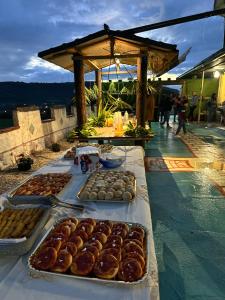 a table with many different types of donuts on it at L'alba dei principi in Albanella