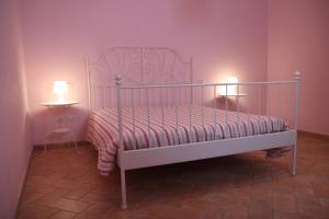 Postel nebo postele na pokoji v ubytování Agriturismo campagna in compagnia
