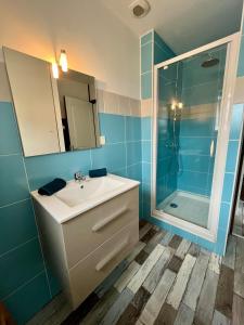 a bathroom with a sink and a shower at La Pause Bain & Nature in Incheville +6 photos