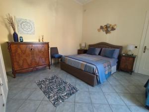 Ένα ή περισσότερα κρεβάτια σε δωμάτιο στο Sestante Guest House