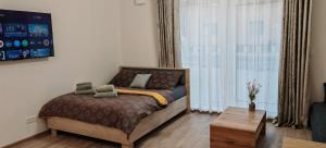Postel nebo postele na pokoji v ubytování Nový Apartmán Na Grůsce Strážnice u Baťáku