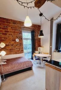 Posteľ alebo postele v izbe v ubytovaní Stara Poczta Apartament