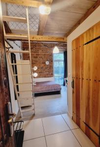 Posteľ alebo postele v izbe v ubytovaní Stara Poczta Apartament