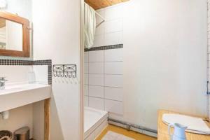 a bathroom with a shower and a sink and a tub at Le bon chemin Ateliers in Sainte-Nathalène +24 photos
